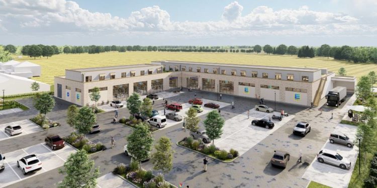 Unten Einkaufen, oben Wohnen: Richtfest für „Pötrauer Tor“